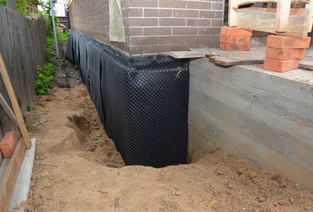 Happy homeowners after waterproofing job in Welcome